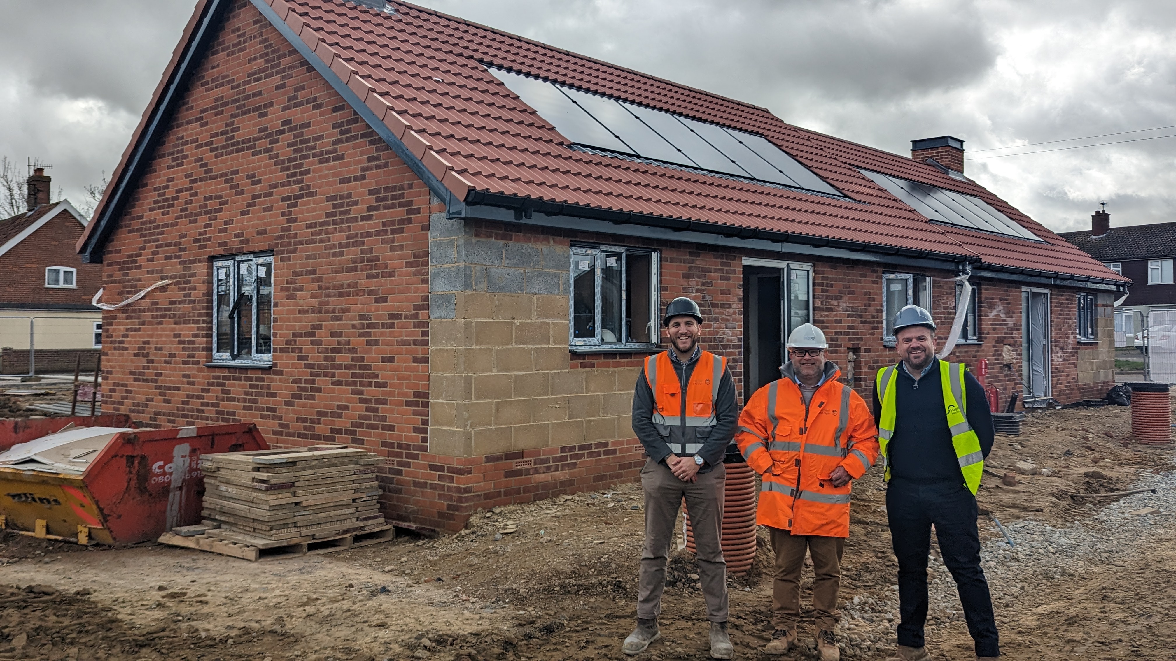 Kyle Crush and Tim Cooper (Marfleet and Blyth) with James Ollington (Flagship Homes) outside one of the South Close, Leiston bungalows