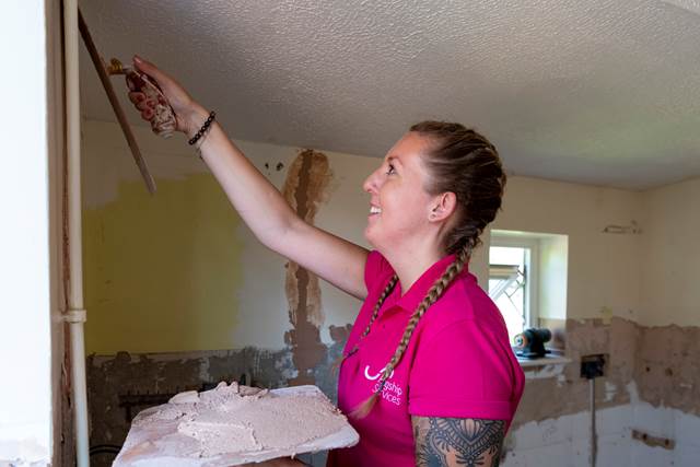 Flagship Services repairing wall