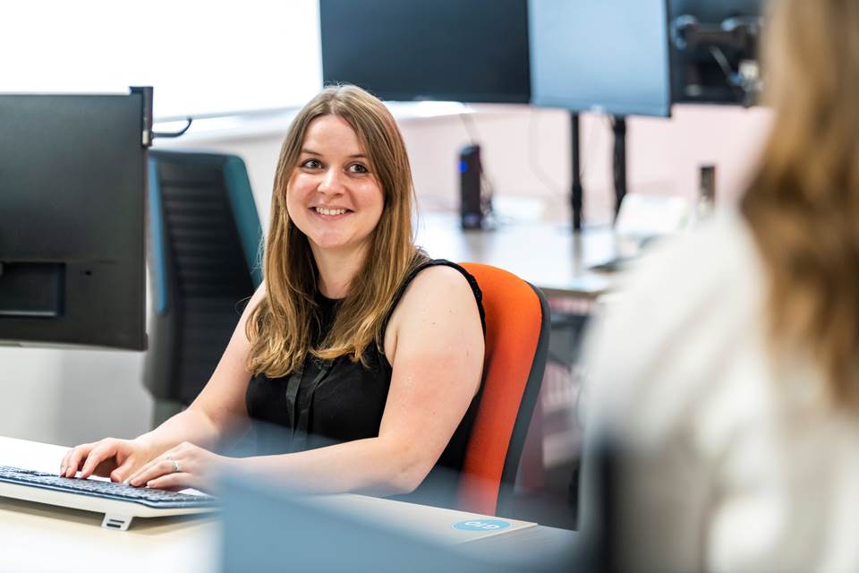 Person working on computer at desk