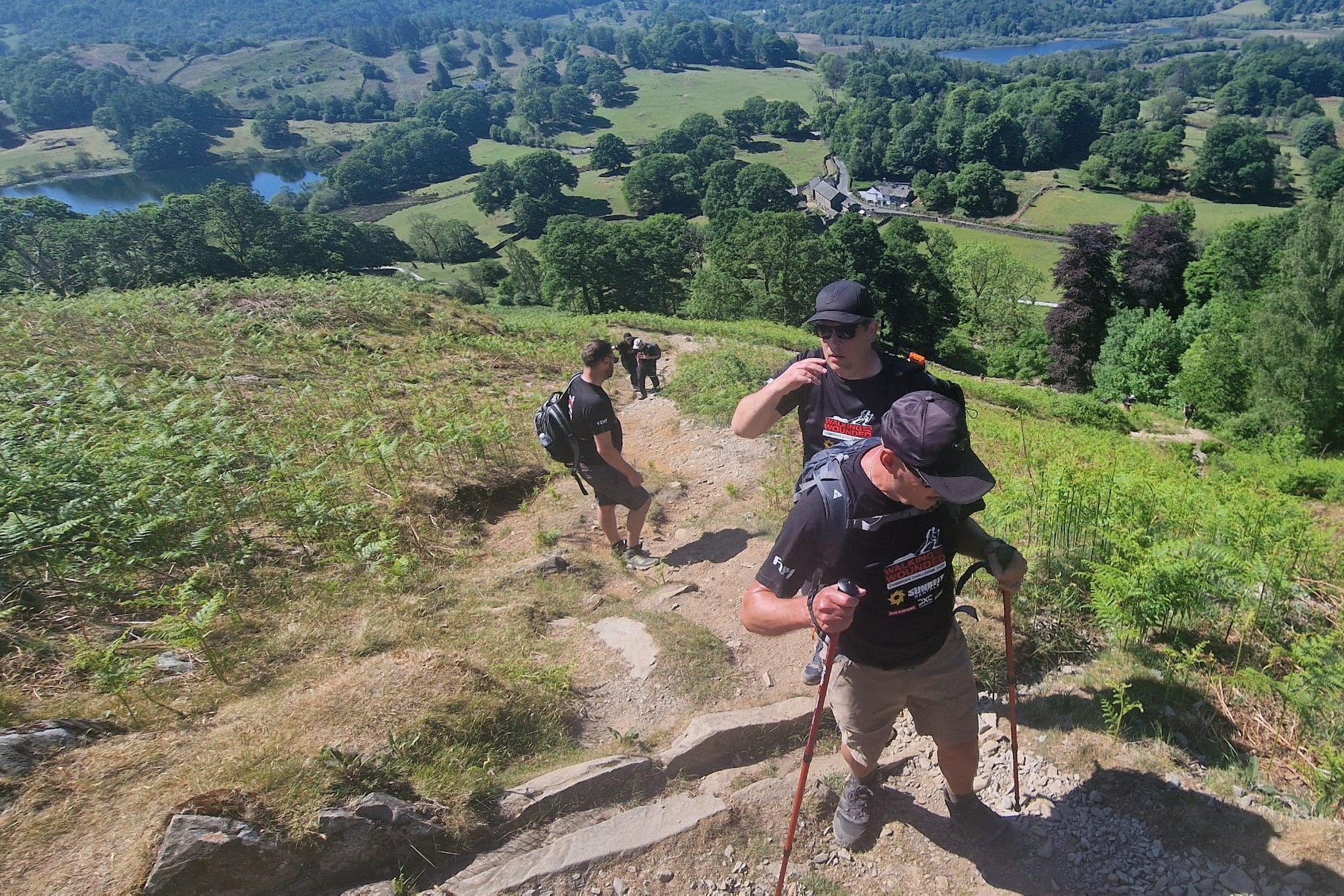 Members of Gasway teams tackling a steep hill during the 2025 Cumbrian Challenge