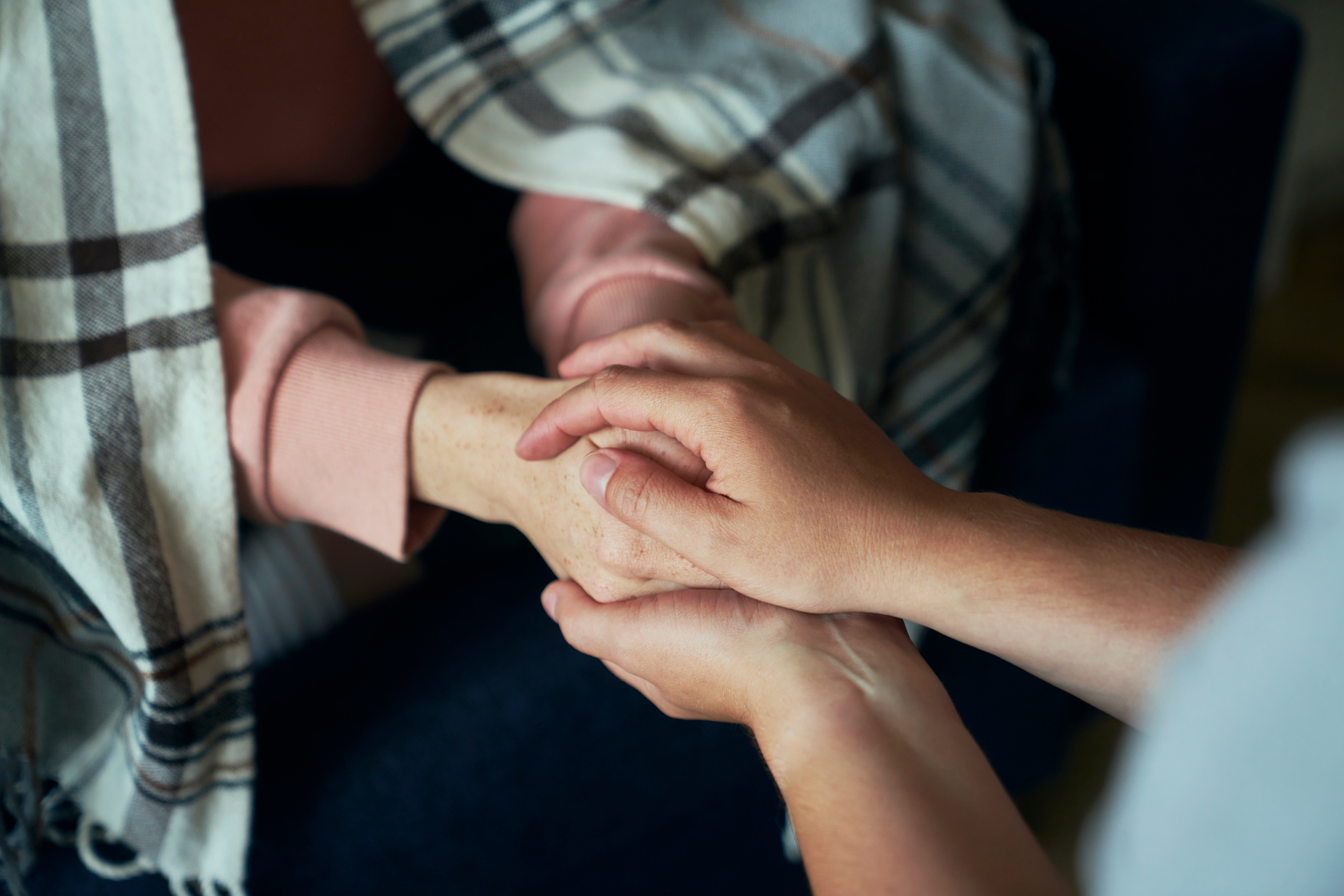 Image of supporting hands