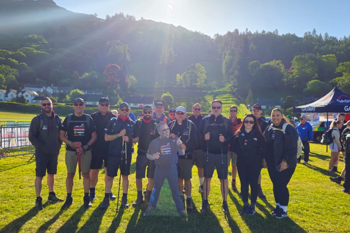 Some of the Gasway teams celebrating at the finish line after completing the epic charity hike