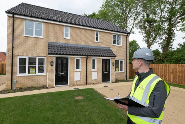 Person inspecting new-build house