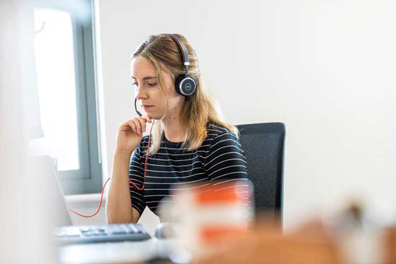 Person on call at desk