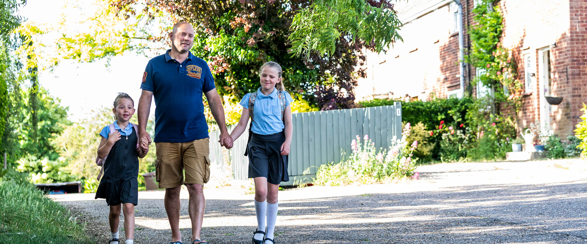 Man and children walking outside