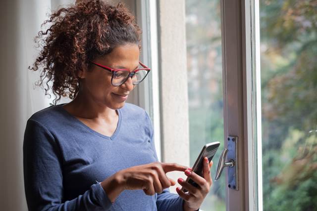 Person scrolling on their phone